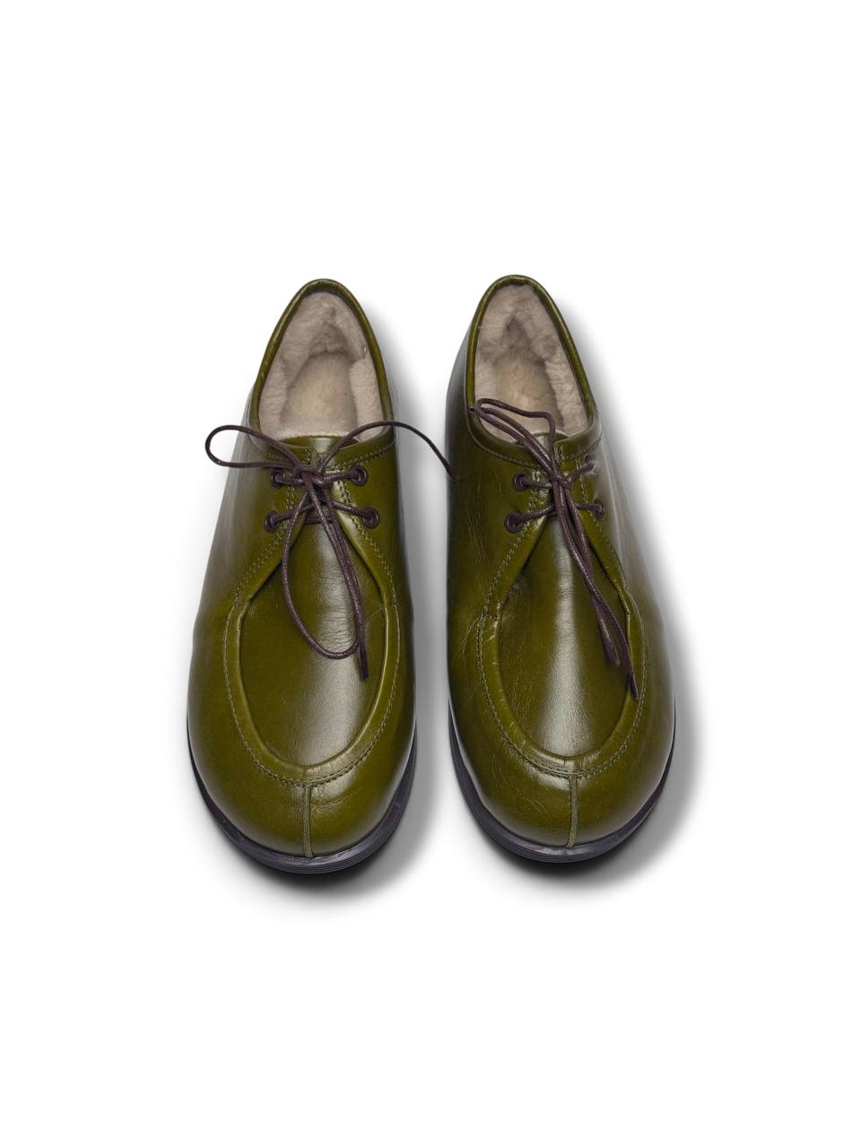 Front view of olive leather walker shoes with rounded toes.