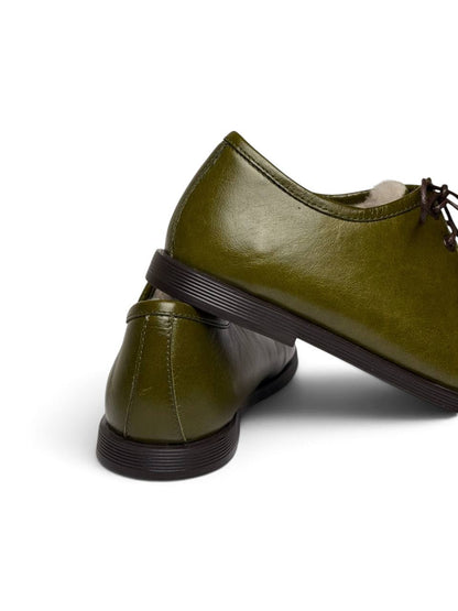 Olive leather walkers with a dark flexible EVA sole.