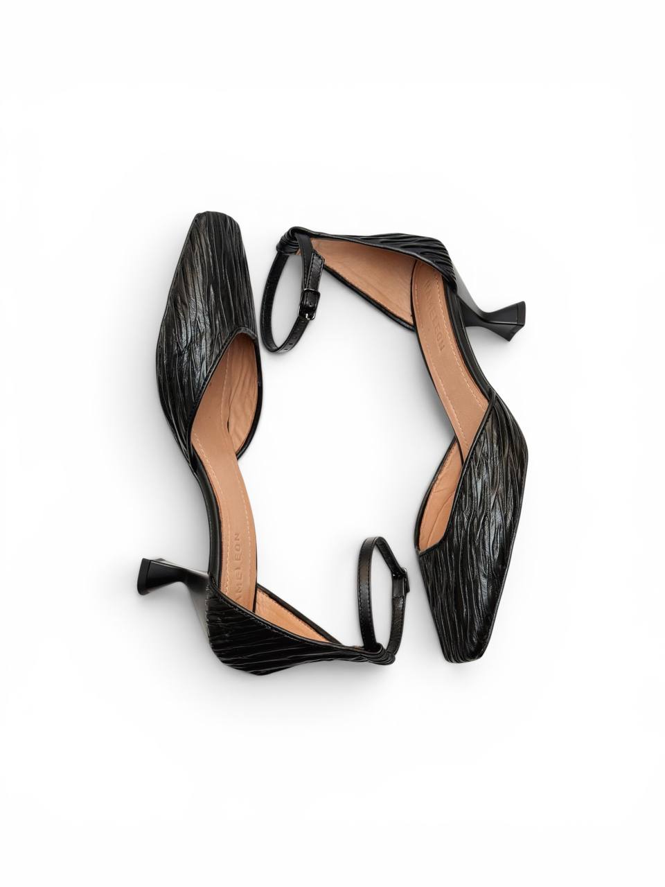 Onyx Pumps featuring refined craftsmanship and understated elegance inspired by minimalist fashion