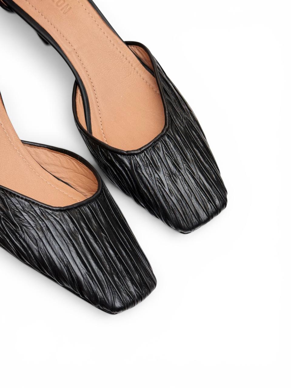 Top view of Onyx Pumps showcasing textured leather and softly squared toe shape