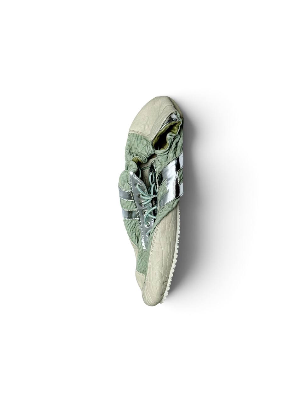 Flexible low-profile sole and soft leather construction of sneakers