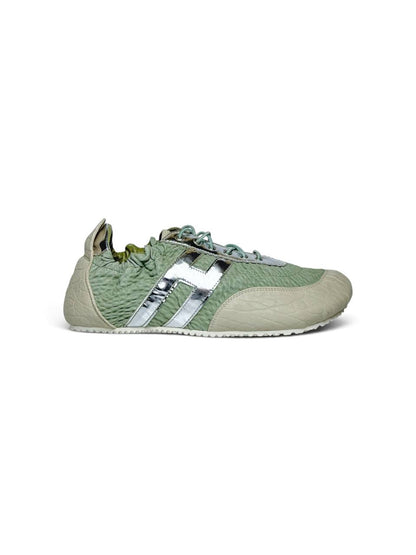 Side view of sage green Reykjavik leather sneakers with silver accents