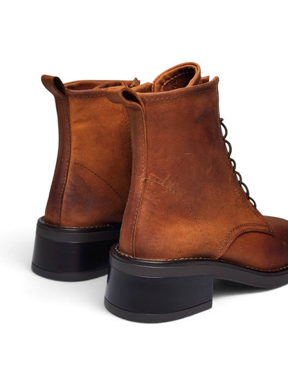 Rear view of brown leather boots with chunky block heels