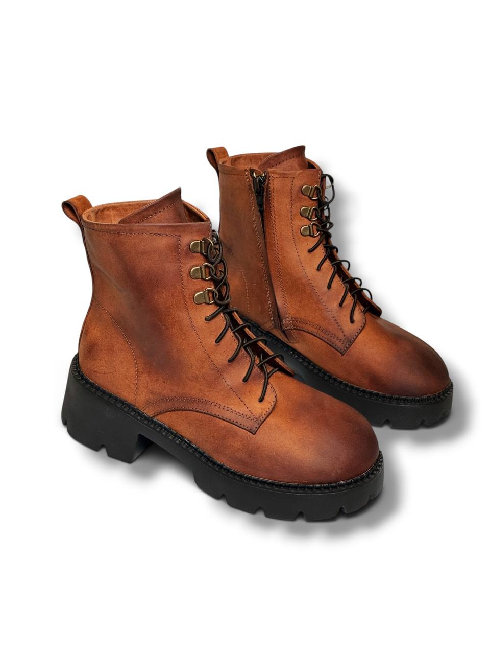 Cognac Crazy Horse leather boots with chunky black soles.