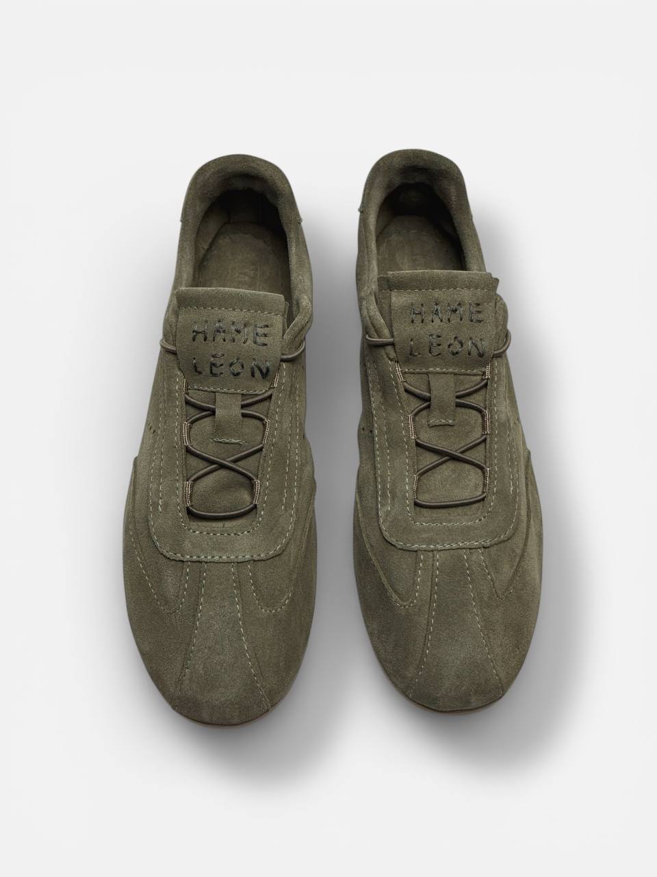 Minimalist suede sneakers top view lace system