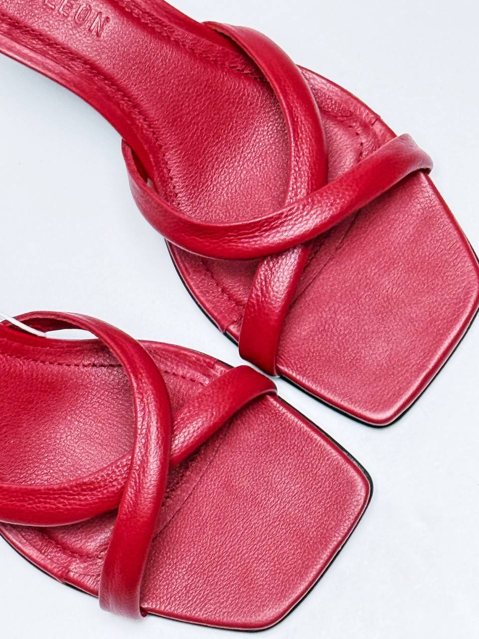 Close-up of Selena Rouge red leather square toe heeled mules