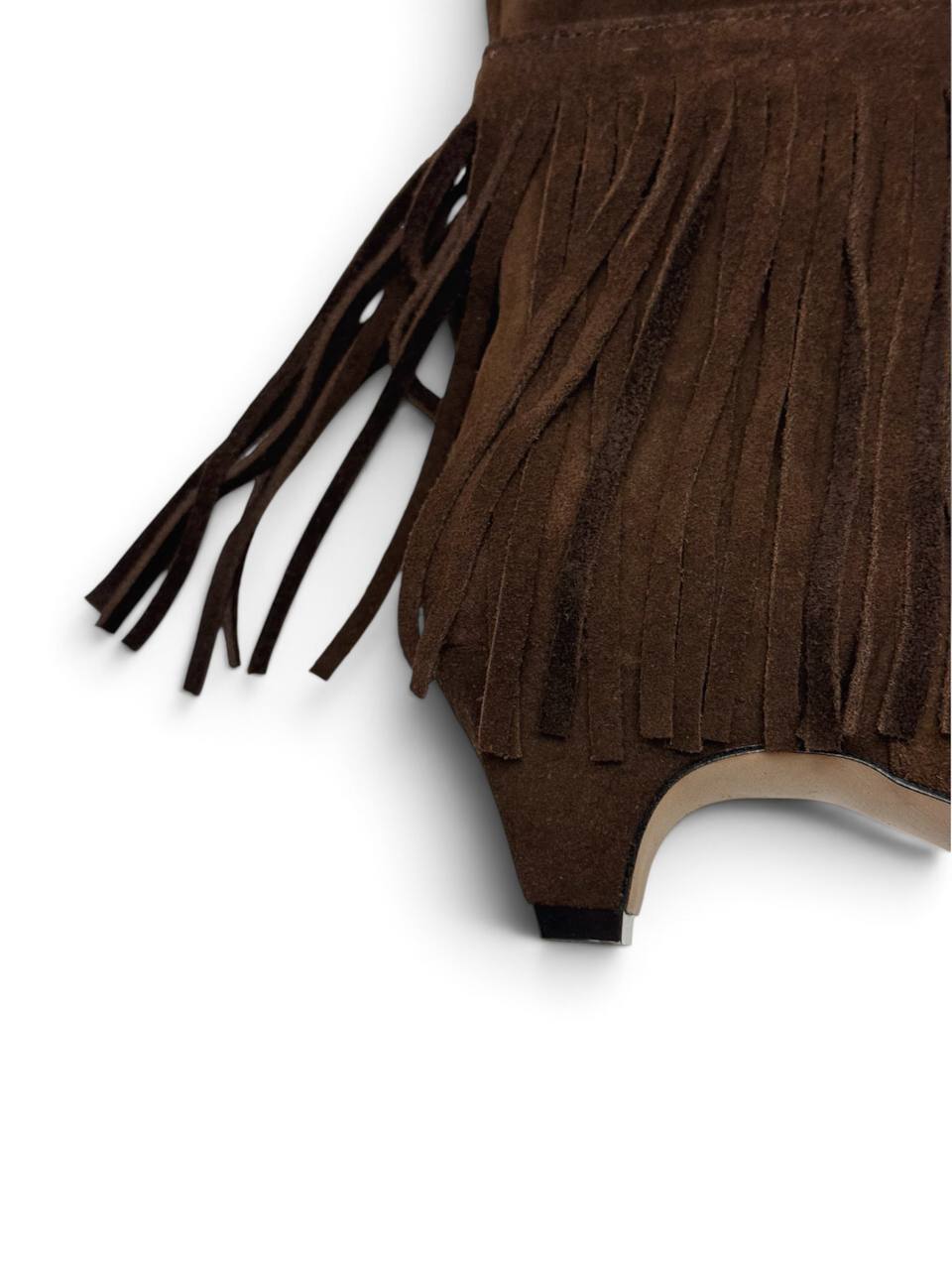 Close-up of soft brown suede fringe on tall boots