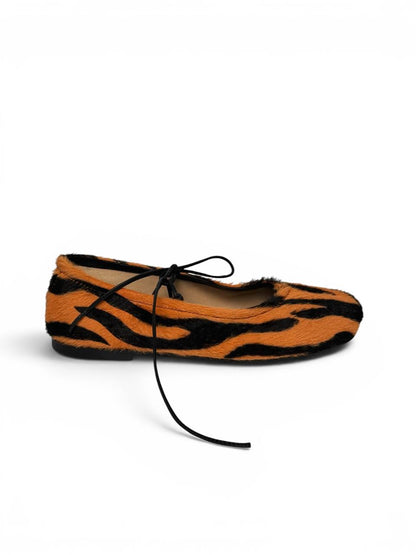 Tiger print ballet flats side profile sleek silhouette