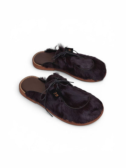 Handmade fur mules in deep espresso color, angled view