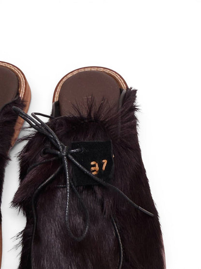 Close-up of natural fur texture and leather laces