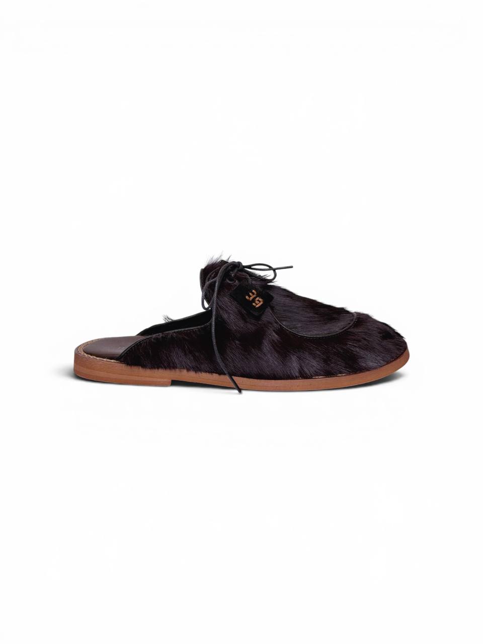 Side profile of espresso fur mules with lace closure