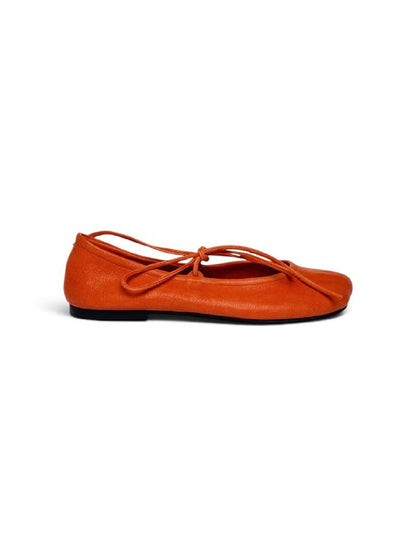 Side view of Valencia orange leather ballet flats with a low flexible sole