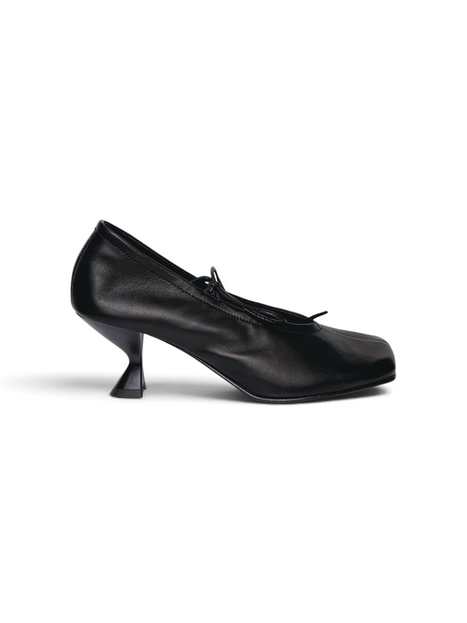 Side profile of black Vesper ballet flats and flared heels