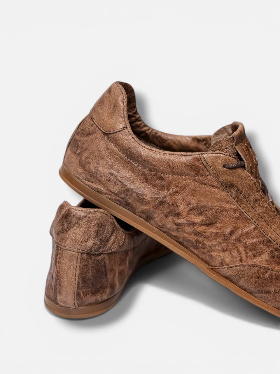 Handmade sneakers heel detail aged leather look