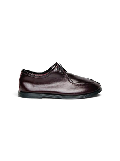 Burgundy leather walker shoe in side profile with flexible black sole