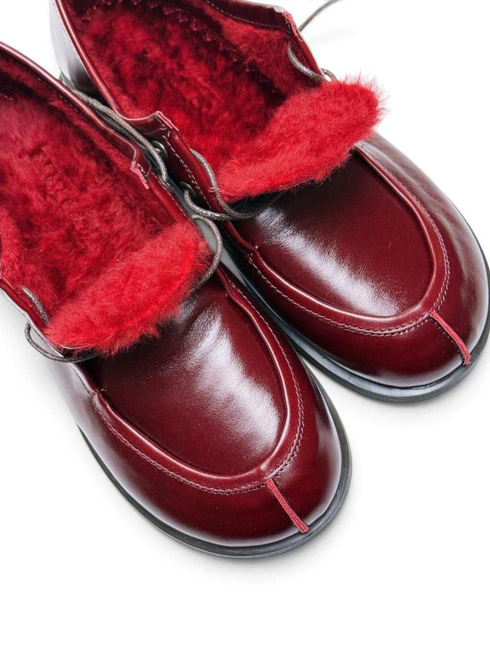 Close-up of red sheepskin and Walkers Carmine toe stitching