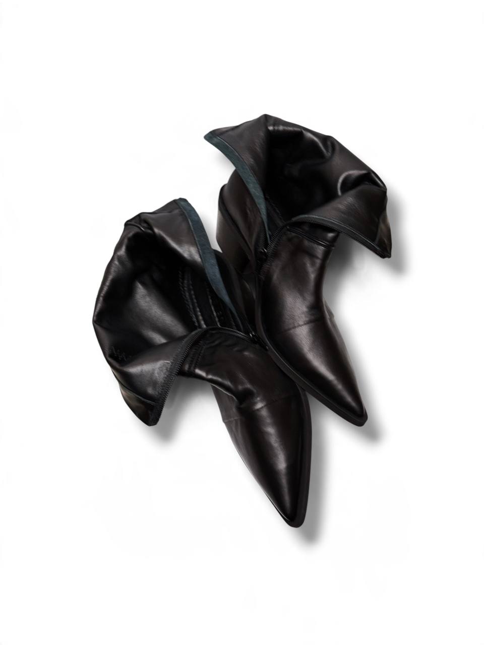 Black Western boots opened to show their leather lining