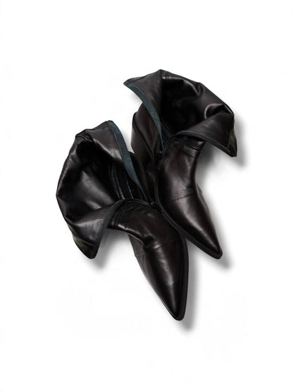 Black Western boots opened to show their leather lining