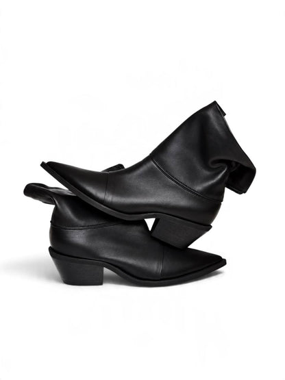 Black Western boots with softly relaxed shafts and pointed toes