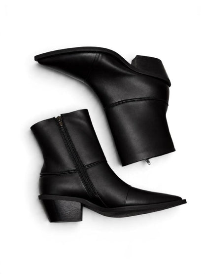 Side view of black leather Western boots with zipper