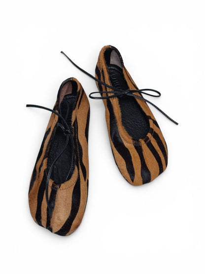 Top view of Wildline leather ballet flats with tiger print pattern